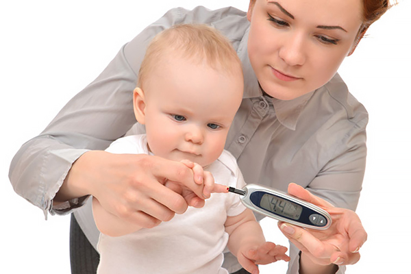 measuring glucose level blood test from diabetes child baby